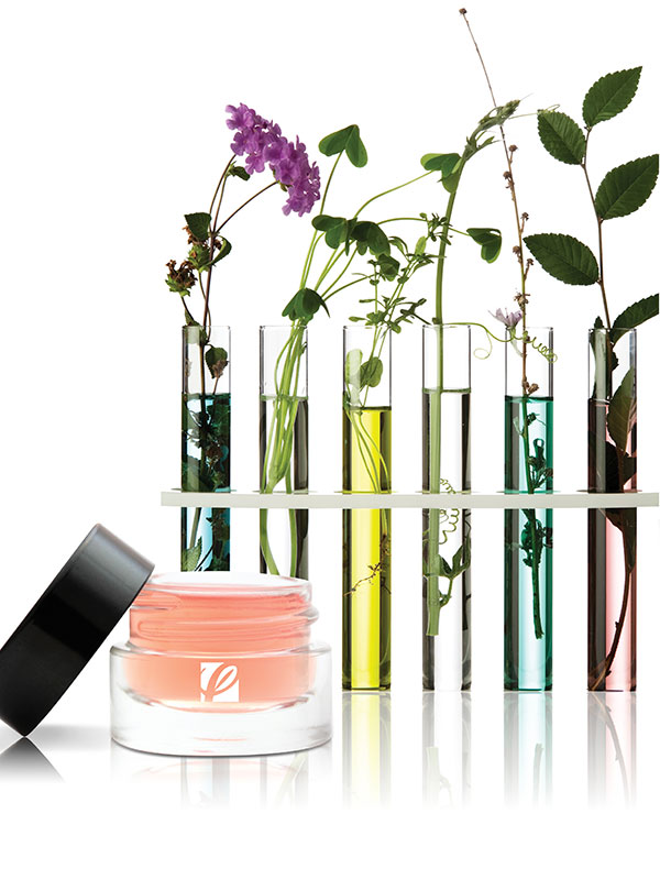 Private Label Skincare Branding Image featuring a cream jar and vials of ingredients and flowers