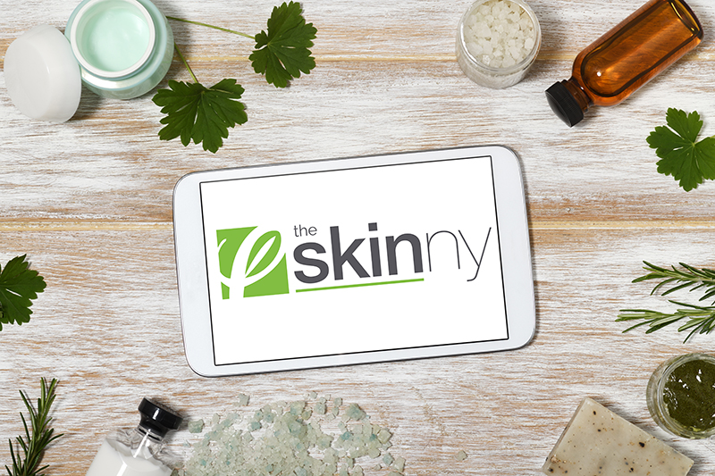 Private Label Skin Care Manufacturer Cosmetic Solutions Login Access Page Image for The Skinny Advanced Skin Care Product Education section. The image features the Skinny Logo imposed on an iPhone render on a desk background.